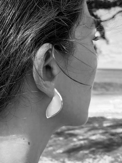 Maresse Moon Slice Earrings Large Sterling Silver wearing beach background